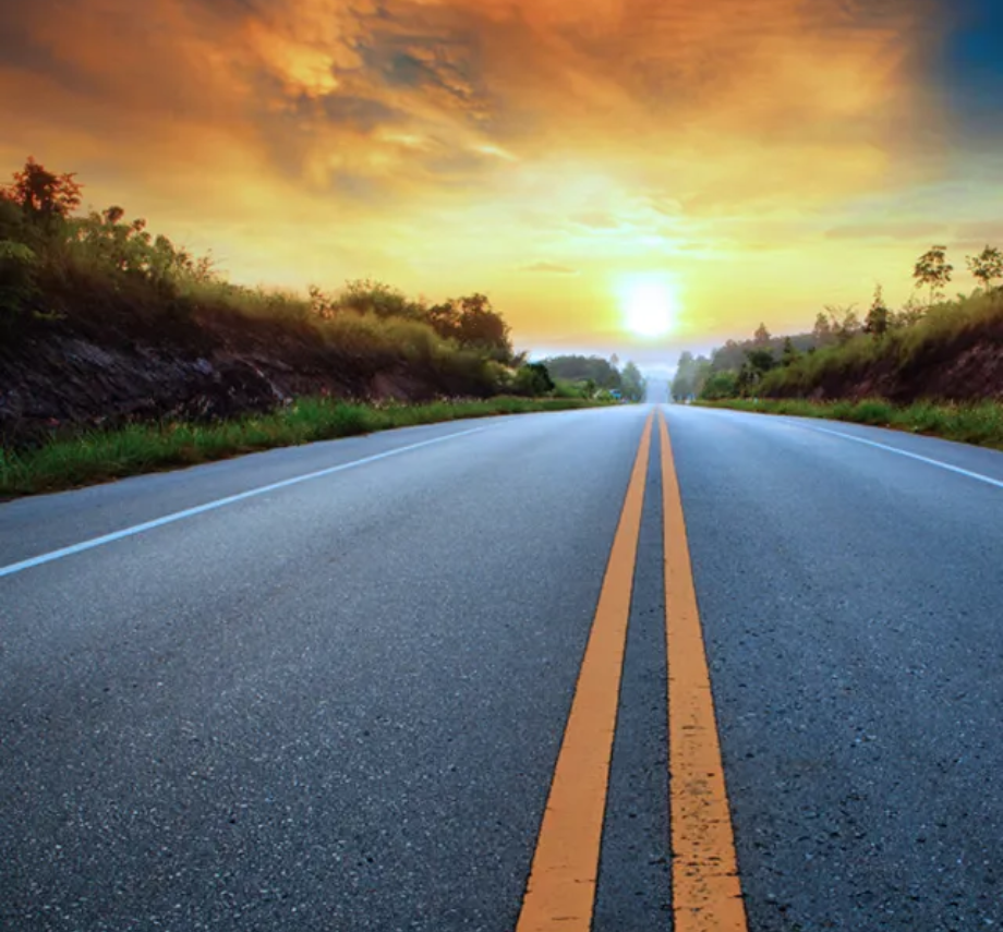 Semi truck and trailer driving on an open road, symbolizing connectivity and optimized fleet performance