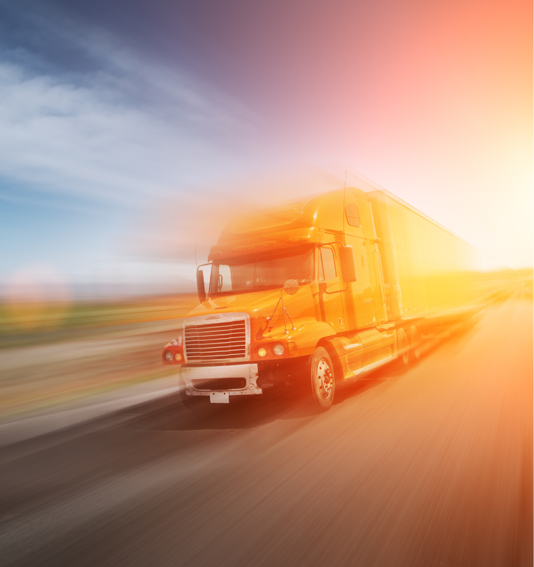 Bright orange semi-truck hauling a trailer speeding along a highway with motion blur effects