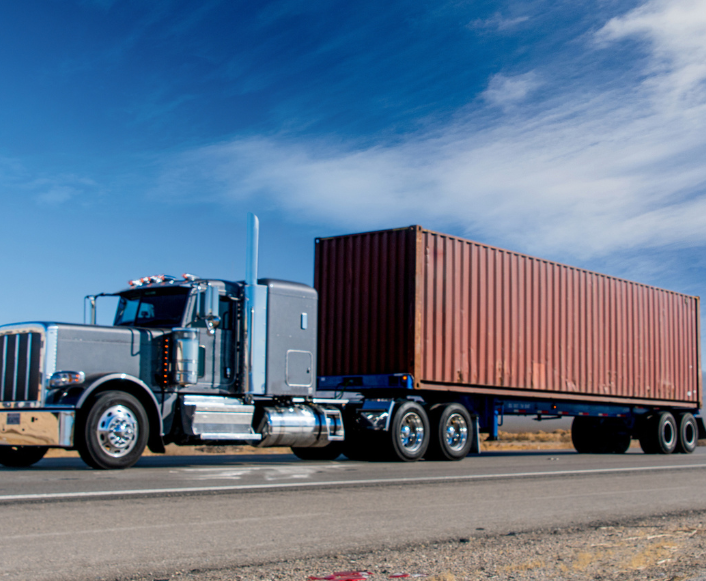 Semi truck hauling intermodal container on chassis with Road Ready trailer tracking system